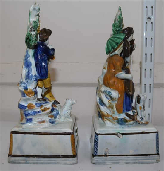 A pair of Pratt-type pearlware groups, c.1810, 21.5cm and 21cm, some high quality restoration